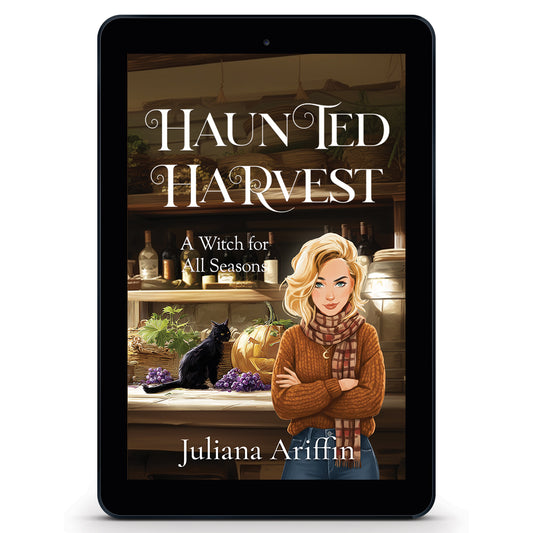 Ebook cover for 'Haunted Harvest' by Juliana Ariffin, a witchy paranormal cozy mystery featuring a blonde woman in a tawny brown sweater and a black cat sitting on a rustic wooden counter next to a carved jack-o'-lantern, bunches of grapes, and a wine barrel.